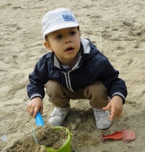 Working hard, tractor, playground Bobi is playning in the sandstone.